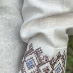 Вишиванка «Даніель» для хлопчика молочного кольору з блакитно-бежевою вишивкою